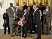 English: President George W. Bush looks up as he welcomes Shaquille O'Neal and the rest of NBA Champion Los Angeles Lakers in the East Room of the White House. Back: Samaki Walker, Jelani McCoy, Lindsey Hunter, Slava Medvedenko, Mitch Richmond, Robert Hor