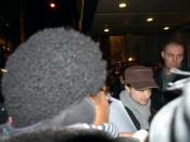 English: Actor Daniel Radcliffe signing authograph outside a theatre