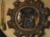 Detail from Jan van Eyck's 1434 Arnolfini Marriage showing the convex mirror place on the wall behind the couple.