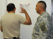 Master Sgt. Urbano Sosa demonstrates the job of an observer for a UPL collection exercise. As observer, maintaining a direct line of sight with a specimen bottle at all time helps to ensure a proper chain of custody and prevents tampering or altering of a