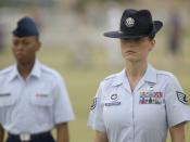 LACKLAND AIR FORCE BASE, Texas -- Staff Sgt. stands at attention during a rite of passage shared by all enlisted Airmen -- the Basic Military Training graduation parade. The parade of 15 squadrons marked the end of the six-week training period for about 7