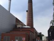 English: Birmingham University power house. The silver chimney serves a huge new packaged boiler. At a guess the big chimney takes the gas turbine exhaust through the HRSG (see the silver ducting) and the buff chimney could be for the turbine on open cycl