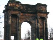 Police officers on horseback in front of McLennan Arch at sunset. Glasgow Green, Glasgow, Scotland.