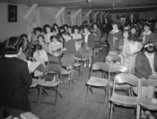 English: Sunday school class, Manzanar Relocation Center, California People in church service, standing, holding hymnals. MEDIUM: 1 negative : safety film.