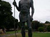 Mokare with spear and woomera, another woomera lies at his feet.