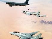 An F-14A Tomcat from VF-32, two EA-6B Prowlers, and a KC-135 Stratotanker during Desert Storm.