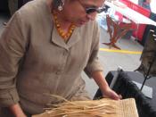 English: Martha Gradolf, contemporary Ho-Chunk weaver, displayed a rush pouch in progress.