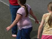 English: These children, playing in a public space, vary in their proportion of body fat.