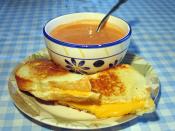 English: I took this picture. Grilled cheese sandwich with white bread, American cheese, and tomato soup.