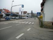 English: A car dealer & a pedestrian crossing in Plattenhardt.