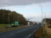 English: A77 with average speed cameras. In this picture can be seen the average speed cameras on their central gantry. About 30 miles of the A77 is covered by these devices.