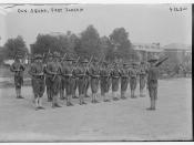 Squad of soldiers with rifles standing with drill instructor