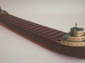English: Scale model of the Lake Superior ore boat Edmund Fitzgerald. Upper bow deck includes observation cabin, horn, searchlight, and liferaft. Upper stern deck includes 2 lifeboats, ladders, crane, 6 barrels, and a smokestack. The smokestack has a pain