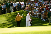 Jack Nicklaus, with his son Jack Nicklaus II as his caddy, walking up to the 9th green during the 2006 par-3 contest held prior to the Masters Tournament.