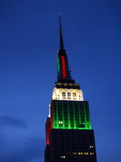 English: Empire State Building lit up red and green.