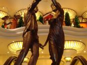 English: The second of two memorials to Diana, Princess of Wales, and Dodi Al-Fayed, located in the Harrods department store in London. The statue, unveiled in 2005, is titled 