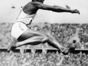 Owens performing the long jump at the Olympics.