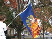 The flag of the US state of New Hampshire being burned.