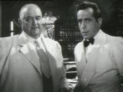This screenshot shows Sydney Greenstreet and Humphrey Bogart in a discussion about whether Sam (Dooley Wilson) will come to work for Greenstreet.