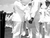 Admiral Chester W. Nimitz pins Navy Cross on Doris Miller, at ceremony on board warship in Pearl Harbor, May 27, 1942