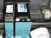 Two cartridges (one with black ink, one with colored inks) installed in an inkjet printer