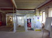 English: This is a typical asbestos enclosure constructed by Trinitas Contracts in the UK for the removal of asbestos sprayed coating from beams.