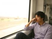 Man thinking on a train journey.