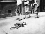 A child dying in the streets of the Warsaw Ghetto