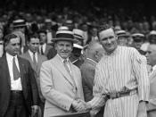 English: US President Calvin Coolidge and Washington Senators pitcher Walter Johnson shake hands, presenting the 
