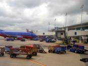 Southwest Airlines ramp operations at William P. Hobby Airport in Houston, Texas, United States. A Boeing 737-500 (N521SW) can be seen in the background parked at gate 45.