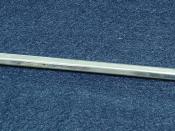 Metal stick with a diamond point for hardness testing.