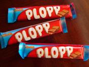 English: Three Plopp candy bars in their wrappers.