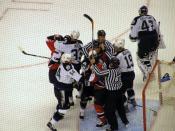Referees attempt to break up a fight around the Tampa Bay goal during the first ice hockey playoff game between the Ottawa Senators and the Tampa Bay Lightning for the 2006 Stanley Cup.