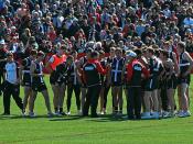 Coach Ross Lyon (centre) addresses the St Kilda Football Club players, an Australian Football League (AFL) team. At training at the Moorabbin Oval in Melbourne the Tuesday before the 2009 AFL Grand Final.