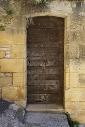 A wooden door. La Roque-Gageac, Dordogne, France.