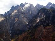 Afternoon light on the jagged grey mountains rising from the Yangzi River gorge, in south-western China's Yunnan Province