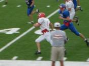 English: Chance Baize running for a touchdown against Claud
