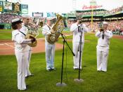 Musicians from the U.S. Navy perform The Star-Spangled Banner prior to a baseball game in Boston