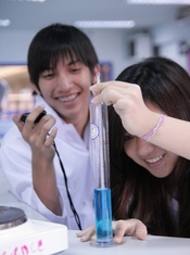English: KIS International School IB Diploma students conducting a Science experiment.