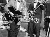English: Bill Haley (in front) and lead guitarist Franny Beecher (right) during a concert in Essen, Germany, in 1958. Deutsch: Bill Haley (mitte) und Gitarrist Franny Beecher (rechts) während eines Konzertes in Essen im Jahre 1958.