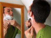 A man shaving with a cut-throat razor