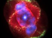 The Cat's Eye Nebula, a planetary nebula formed by the death of a star with about the same mass as the Sun.