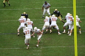 Running back Henry Melton (#37) receiving the handoff and rushing the ball for the Texas Longhorns