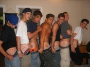 Members of a fraternity displaying their new heart brands.