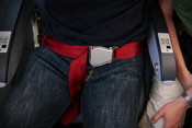 Seat belt on an airplane, buckled-up