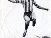 English: Frank Jeeves kicking football for North Melbourne Football Club