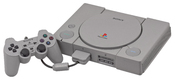 English: A Sony PlayStation (SCPH-5001), shown with a DualShock controller and Memory Card. This is the JPG version. Deutsch: Ein Sony PlayStation Spielkonsole (SCPH-5001), mit einem DualShock Gamecontroller und Speicherkarte angezeigt. Dieses ist die JPG