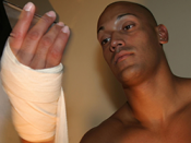 A fighter wraps his hands prior to putting gloves on.