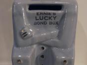 English: Photo of a money box in the shape of a personification of ERNIE the computer that draws the UKs Premium Bonds