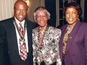 Congressman Edlophus Towns (left) and his wife, Gwen Towns (right) pose with former Congresswoman and Brooklyn native, Shirley Chisholm (center)